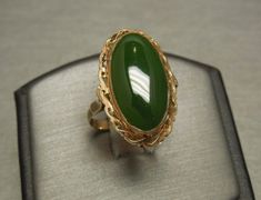 "Vintage Circa 1950 In a Victorian Style Constructed of 10KT Yellow Gold Accented with a Milligrain border & bezel Containing 1 Central Bezel set Genuine Earth-Mined Elongated Oval Piece of Natural Jade measuring approximately 20mm in length x 10mm in width Top section of ring measuring approximately 1\" in length Inside shank: 10K Additional photos/details upon request. Finger Size 6.5 *Sizing upon request (Sizing down runs about $25.. Sizing up starts at $45) Ring weighing 4.5 grams Apprai Fashion Jewelry Necklaces Gold, Elongated Oval, Baby Krishna, Bridal Gold Jewellery Designs, Beautiful Wallpaper, Classy Jewelry, Jade Ring, Square Rings, Fun Quotes