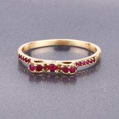 "Gold Ruby Ring, Natural Ruby Round Knot Ring in 14k Yellow Gold, Ruby Ring, 14k Gold Ruby & Diamond Ring, July Birthstone, Bridal Gift  Make a big statement with this dazzling ruby knot ring. Expertly crafted from fine finish 14k yellow gold, the ring features natural ruby gemstones with a total weight of 0.32 ct. t.w. and round shape. This ring is a beautiful piece that deserves a place in almost any jewelry collection. Product Details:  14K Yellow Gold Stone Details: Ruby Item Type: Ring Gros Luxury Ruby Open Ring For Promise, Luxury Open Ruby Ring As Promise Ring, Luxury Open Ruby Ring For Promise, Luxury Ruby Birthstone Ring As Gift, Luxury Classic Ruby Birthstone Ring, Luxury Pink Gold Ruby Ring With Prong Setting, Luxury Gift Ruby Ring With Birthstone, Luxury Engraved Ruby Ring For Promise, Luxury Rose Gold Ruby Ring With Birthstone