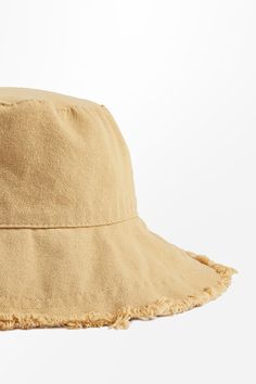 The Khaki Frayed Trim Bucket Hat features a trendy frayed edge that sets it apart from the rest. Ideal for those days when you want to stay cool and stylish with minimal effort. Product code: CAC03B4H003HH Features:  Material: 100%POLYESTER. Distressed Brown Summer Hat, Distressed Hats For Beach In Summer, Distressed Beach Hat For Summer, Distressed Summer Beach Hats, Casual Sun Hat With Fringe, Summer Distressed Adjustable Bucket Hat, Adjustable Distressed Bucket Hat For Summer, Casual Hats With Fringe And Curved Brim, Casual Vacation Hats With Fringe