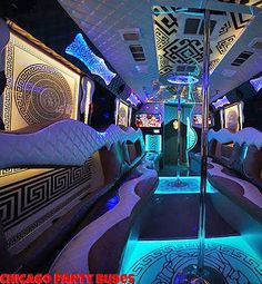 the inside of a party bus decorated in white and blue lights, with decorative decorations