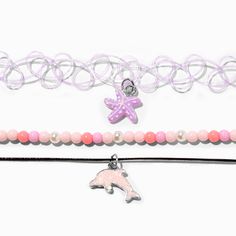 Purple Starfish & Pink Glow in the Dark Dolphin Choker Necklaces - 3 Pack | Claire's US Purple Tattoo, Purple Starfish, Purple Tattoos, Dolphin Charm, Cord Choker, Pink Dolphin, Chantel Jeffries, Life Aquatic