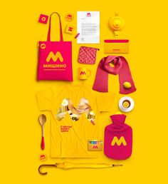 the mcdonald's merchandise is laid out on a bright yellow background with red accessories