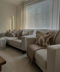 a living room filled with furniture and pillows