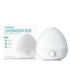 the humidifier is next to its box on a white surface with information about it