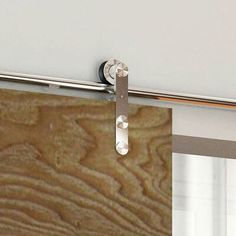 a close up of a sliding glass door with woodgrain on the outside wall