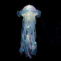 a jellyfish is floating in the dark water