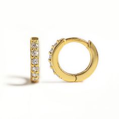 Minimal Gold huggie hoop earrings that hug your ear perfectly. Pave crystals give an extra sparkle to a classic shape. Perfect to wear alone or paired with other dainty earrings. Gold Vermeil Cubic Zirconia pave crystals Hypoallergenic, lead and nickel free Width: 1.5mm Inside Diameter: 5.5mm, 6.5mm, 7.5mm, 8.5mm, 9.5mm Click close mechanism #E531-G Gold Huggie Hoop Earrings, Huggie Earrings Gold, Backdrops Necklace, Minimal Gold, Back Necklace, Jewelry Bridal, Cubic Zirconia Earrings, Zirconia Earrings, Bridal Gold Jewellery