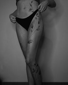 a woman with tattoos on her stomach