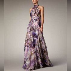 New Badgley Mischka Collection High Neck Floral Gown - Florals And Painterly Prints - Halter Neck Gown - Strapless Cascading Peplum Dress - Shell: 100% Silk - Lilac - Size 2 Purple Floor-length Gown For Prom, Purple Sleeveless Maxi Dress For Prom, Purple Sleeveless Maxi Dress For Prom Season, Elegant Purple Wedding Guest Gown, Purple Maxi Length Prom Dresses, Purple Spring Gala Maxi Dress, Purple Summer Evening Dress For Gala, Purple Maxi Dress For Spring Gala, Purple Spring Maxi Dress For Gala