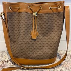 Gucci Shoulder Bag Bucket Bag Style Vintage From The 80”S Good Condition With Minor Wear. Mark On The Side Leather Trim See Pic Minor Wear On Piping Bottom See Pic Bucket Bag Style, Bucket Handbags, Gucci Shoulder Bag, Classic Bags, Canvas Leather, Tan Brown, Leather Trims, Panel Siding, Bucket Bag