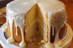 a bundt cake with white icing on a plate