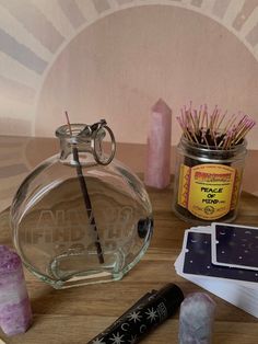 an assortment of items on a table including candles, incense sticks and matchesticks