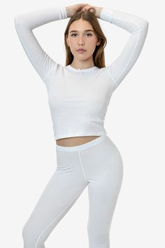 This thermal long sleeve top is an essential layering piece for the winter. Made of our 50/50 poly cotton waffle knit that keeps you comfortably warm and cozy. Features a delicate bow at the neckline, ribbed wrist cuffs and finished with durable flatlock seams. Try pairing with our matching T3280 Baby Thermal Leggings for a cute sleep or loungewear look. Runs true to size. Made in Los Angeles, Calif. Our experienced sewers earn up to $25 an hour and no less than $17.78; additionally workers have Cute Sleep, Bus Pass, Thermal Leggings, Thermal Long Sleeve, Wrist Cuffs, Layering Pieces, Waffle Knit, 50 50, The Winter