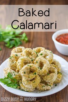 baked calamari on a white plate with parsley