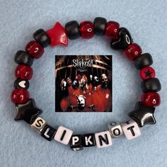 Slipknot Kandi Bracelet  - handmade by me! - please... - Depop Slipknot Kandi, Slipknot Jewelry, Metallica Bracelet, Kandi Bead Bracelet Ideas, Spiderman Kandi, Bracelet Ideas Kandi, Band Bracelet Ideas, Kandi Bracelets Ideas