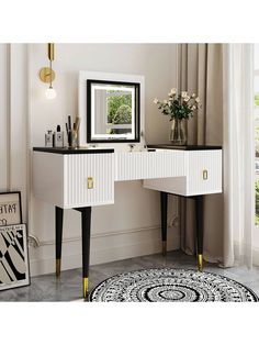 a white vanity table with black and gold trimmings in front of a mirror