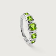 Indulge in the exquisite elegance of Rachel Galley's Candy Peridot 5 Stone Ring. Adorned with five vibrant peridot stones, this ring effortlessly adds a touch of luxury to any outfit. A perfect blend of style and sophistication, it’s designed to make you shine with confidence. Peridot CUSHION 5x5mm Vermeil - 5X better than plating, it's only done on silver, Peridot, with its vivid green hue, has been adored for thousands of years and is often referred to as the "gem of the sun." This gemstone, mainly found in places like Arizona, Egypt, and Pakistan, is known for its ability to inspire creativity and bring a sense of peace and balance. Its unique colour comes from the presence of iron, giving it a distinctive glow that pairs beautifully with any outfit. Lime Green Peridot Rings For Gifts, Green Peridot Hallmarked Rings, Lime Green Peridot Birthstone Ring, Peridot Rings With Polished Finish, Luxury Multi-stone Peridot Ring, 5 Stone Ring, Peace And Balance, Pearl Birthstone, Gold Vermeil Jewelry