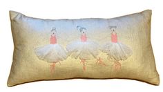 three ballerinas in white tutu skirts on a gold linen lumba pillow