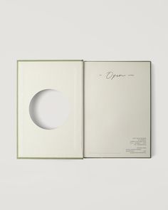 an open book with a white circle on it