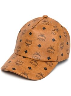 Visetos monogram print cap from MCM featuring cognac brown, black, canvas, signature Visetos print and curved peak. | MCM Visetos monogram print cap Luxury Beige Baseball Cap, Luxury Brown Cap, Designer Brown Visor Baseball Cap, Luxury Brown Hat With Embroidered Logo, Luxury Brown Visor Baseball Cap, Luxury Adjustable Brown Baseball Cap, Designer Brown Baseball Cap, Designer Brown Hat With Embroidered Logo, Trendy Brown Baseball Cap With Curved Visor