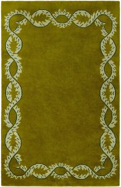 a green rug with an ornate border in the middle and white trim around the edges