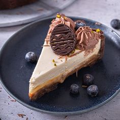 a piece of cheesecake on a plate with blueberries