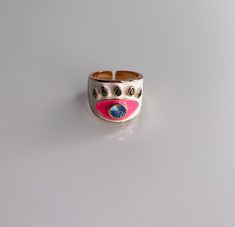 Gorgeous enamel Ring! This ring is more than a fashion statement, it is also a beautiful piece of artwork! Grab yours today! Specifications: . Enamel - Turquoise and Blue Evil Eye Ring . Adjustable Adjustable Pink Enamel Rings, Pink Enamel Rings For Gift, Pink Open Enamel Ring, Pink Enamel Open Ring, Trendy Open Enamel Ring For Gift, Trendy Open Enamel Ring As Gift, Gold Enamel Hand Painted Rings, Trendy Pink Enamel Ring For Gift, Trendy Pink Enamel Ring As Gift