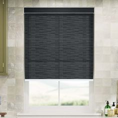 a kitchen window covered in gray shades