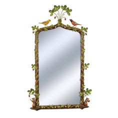 a mirror that has birds on it and leaves around the edges, hanging from a wall