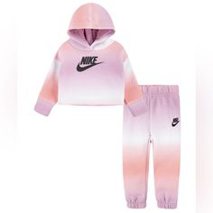 Get The Full Nike Look In This Unique Printed Club Hoodie Joggers Set. Featuring A Cool Pullover Hoodie And Fleece Jogger Pants, Both In Gradient All-Over Print, This Outfit Definitely Is A Statement. Set Includes - 1 Hoodie And 1 Joggers Soft, Light Weight Fleece Imported Nike Logo At Chest Ribbed Cuffs Stretch To Hold In Warmth Size & Fit Jogger Pants With An Elastic Waistband And Cuffs For Comfy Fit Regular Fit For An Easy Feel Material & Care Machine Washable Cotton, Polyester Nike Long Sleeve Loungewear Sets, Nike Loungewear Sets, Pink Cotton Hooded Sets, Hooded Pink Cotton Sets, Nike Loungewear Sets For Winter, Nike Winter Loungewear Sets, Purple Cotton Playwear Sets, Pink Long Sleeve Sportswear Set, Nike Cotton Sportswear Sets