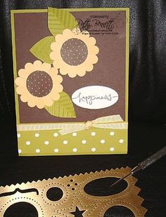 a card that has some flowers on it and a pair of scissors next to it