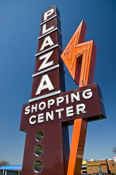 a large sign that says plaza shopping center