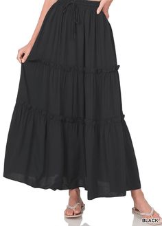 This full-length skirt is designed with an effortless pull-on waistband and a tiered A-line silhouette. This maxi style is made with a soft rayon fabric that's as lightweight as it is lovely, perfect for any day styling. Appx. 37"-38" length. True to Size Functional drawstring Elastic Waistband 100% Rayon WAIST: S- 26" M- 28" L- 30" XL- 32" 1X- 34" 2X- 36" 3X- 38" Plus Boho, Ruffle Maxi Skirt, Fringe Fashion, Black Maxi Skirt, Tiered Maxi Skirt, Full Length Skirts, Womens Maxi Skirts, Maxi Styles, Flowy Skirt