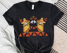 We have for you our fun t-shirt with a Mexican cultural theme of Cinco de Mayo, for your celebration with family and friends. This is the representative garment to wear at work on this holiday, we are sure that you will receive praise and compliments and have a fun time. It can be the perfect gift for dad, mom, friend, or coworker. mexican fiesta,mexican birthday,mexican friendship,spanish tshirt,cinco de mayo tshirt,drinking shirt,cinco de mayo party shirt,party squad,tequila shirt,margarita shirt, Mexico party, friends party shirt, Cinco de Mayo party, Mexican family party, Let's party shirt, tacos shirt, Mexican tacos, taco team, tacos squad 👉 Unisex T-shirt. Bella-Canvas This classic unisex knit short sleeve t-shirt fits like a well-loved favorite. The soft cotton and quality print ma Mexico Party, Margarita Shirt, Tacos Mexicanos, Mexican Birthday, Mexican Tacos, Tequila Shirt, Mom Friend, Taco Shirt, Friends Party