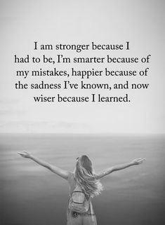 a woman with her arms outstretched in front of the ocean, saying i am longer because i had to be