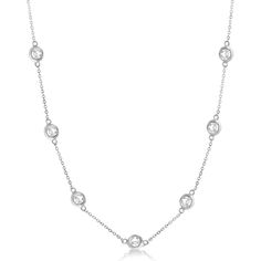 Style Number - AZ18855
Seven brilliant-cut round lab grown diamonds, of G-H color and SI1-2 clarity, dazzle in this lab grown diamond chain necklace. These stunning lab grown diamonds wrap half way around this necklace, and are set in a 14k white gold bezel setting. This stylish, classy lab grown diamonds by the yard necklace is a perfect match for that elegant woman in your life.Available in other lab grown diamond carat weights, and in 16, 18, 20 and other lengths. If you would like this neckl Diamonds By The Yard Necklace, Diamonds By The Yard, Bezel Set Necklace, Diamond Chain Necklace, Halo Necklace, White Gold Chains, Diamond Chain, Station Necklace, Diamond Pendant Necklace