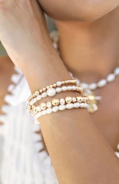 Stack on the shine with this party-ready bracelet set illuminated by cultured freshwater pearls and 18-karat gold-plated beads. Set includes four bracelets Pearl size: 4-6mm Cultured freshwater pearl/18k-gold plate Imported Pearl Bracelet With Spacer Beads, Pearl Bracelets With Spacer Beads, Adjustable Gold Pearl Bracelet For Festive Occasions, Pearl Bracelet With Gold Beads And Round Beads, Elegant Stackable Pearl Beaded Bracelets, Adjustable White Pearl Bracelet For Festive Occasions, Party Beaded Bracelets With Pearl Charm And Round Beads, Festive Adjustable White Pearl Bracelet, Gold Pearl Beaded Bracelets