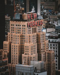 an aerial view of the new york city skyline with skyscrapers in the foreground