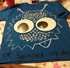 a blue t - shirt with an eyeball design on it