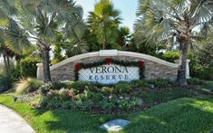 the sign for vernon reserve in front of palm trees