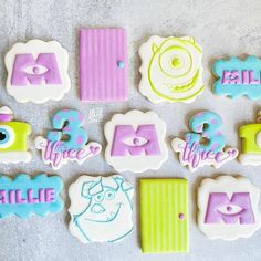 decorated cookies are arranged in the shape of letters