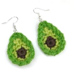 green and brown crochet earrings on white background