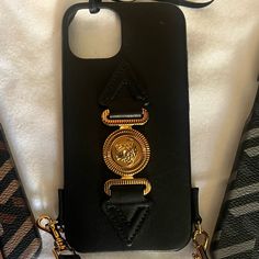 Brand New Iphone 12/13 Iphone Case This Cute, Popping Phone Case From Versace Is Elevated By Signature Medusa Head Motif And A Sturdy, Detachable Shoulder Strap. Black With Goldtone Hardware Leather & Synthetic Made In Italy Size Fits Iphone 12 Detachable Shoulder Strap,16"-19.5" Drop 5.75"W X 3"H Versace Phone Case, Luxury Black Rectangular Phone Case, Luxury Gold Rectangular Phone Accessories, Luxury Black Mobile Phone Bag, Luxury Rectangular Mobile Phone Bag, Luxury Black Phone Accessories, Elegant Black Phone Case, Elegant Black Rectangular Phone Accessories, Elegant Black Rectangular Phone Case