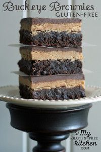 a stack of brownies sitting on top of a white plate