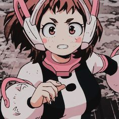 an anime character wearing headphones and holding a pink object in front of her face