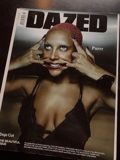 the cover of dazed magazine with a woman's face and hands on her head