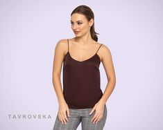 "A minimalist satin camisole top featuring spaghetti straps, v-neckline, and semi-fitted silhouette. - spaghetti straps - slip style - v-neck - brown color - semi-fitted silhouette Fiber: polyester - 55%, viscose - 40%, elastane - 5% Color: brown For size S: length- 22,83\"(58cm) Our model wears S (06) and is 171cm/5'6\" tall You may feel free choosing the size. Just send us your measurements (bust, waist, hips, height). We will define your correct size. SIZE CHART XS __ EU 34 __ US 4 bust: 31,5 Satin Tops For Women, Satin Tops, Satin Camisole, Slip Top, Spaghetti Strap Top, Satin Top, Strap Top, Fitted Silhouette, Strap Tops