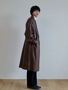 Editor's NotesThis trench coat features faux leather material, oversized fit, dropped shoulder. It can be styled in various ways. For unisex.- Faux leather material- Oversized fit- Dropped shoudler- Glossy texture- Belt pointMeasurements(in.)1 / 2 - Shoulder: 22.05 in. / 24.02 in.- Chest: 25.59 in. / 27.17 in.- Sleeve: 23.62 in. / 25.59 in.- Total length: 45.67 in. / 47.24 in.Model info: MAN - 6' 1'' Fitting size 2 / WOMAN - 5' 6'' Fitting size 2Composition & Care- 100% Poly- Please che Oversized Faux Leather Winter Outerwear, Winter Oversized Faux Leather Outerwear, Oversized Faux Leather Outerwear For Fall, Modern Oversized Leather Outerwear, Oversized Brown Leather Outerwear, Oversized Leather Winter Outerwear, Oversized Leather Outerwear For Fall, Brown Overcoat, Leather Coat