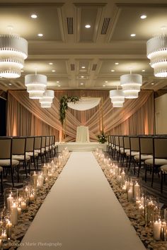 an image of a wedding setup with candles on the aisle