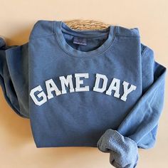 Cozy up with our Comfort Colors Game Day Football Crewneck Sweatshirt this fall season! The perfect gift to all football lovers our there! - Our sweatshirt material is super soft and high quality! ♡ - Garment-Dyed Sweatshirt (Sustainable style)  - 80% cotton, 20% polyester - All our sweatshirts run a UNISEX fit. (Both for men and women) They fit true to size. But if you like a more baggy look, we highly recommend sizing up. - These letters are embroidered iron-on patches that have been heat pres Cheap Casual Game Day Sweatshirt, Cheap Casual Sweatshirt For Game Day, Cheap Blue Sweatshirt For Game Day, Cheap College Style Sweatshirt For Game Day, Cheap Crew Neck Tops For Football Season, Cheap Blue Sweatshirt For Fan Gear, Cheap Collegiate Sweatshirt For Football Season, Cheap Football Season Fan Gear Sweatshirt, Game Day Sweatshirt